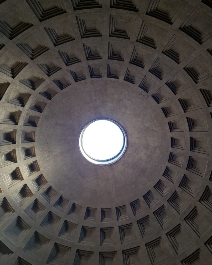 Looking straight up at the Oculus, the open hole in the center of the Pantheon's concrete dome.