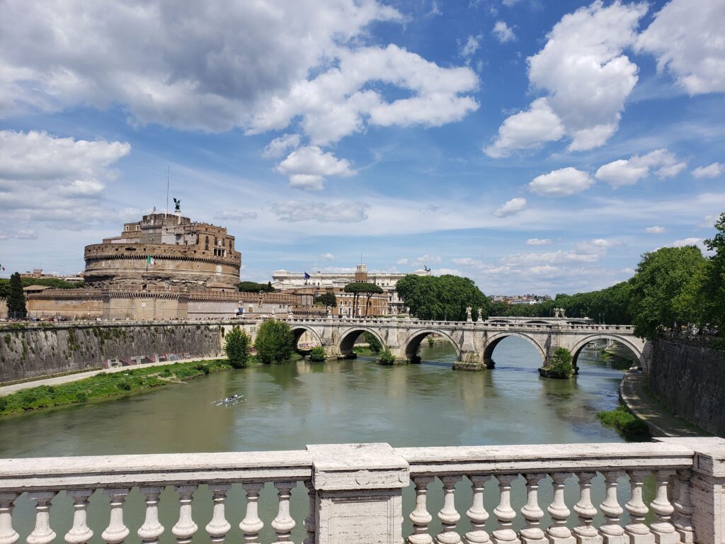Scenic view of the Tiber River, the Bridge of Angels, and Castel Sant'Angelo in Rome.
