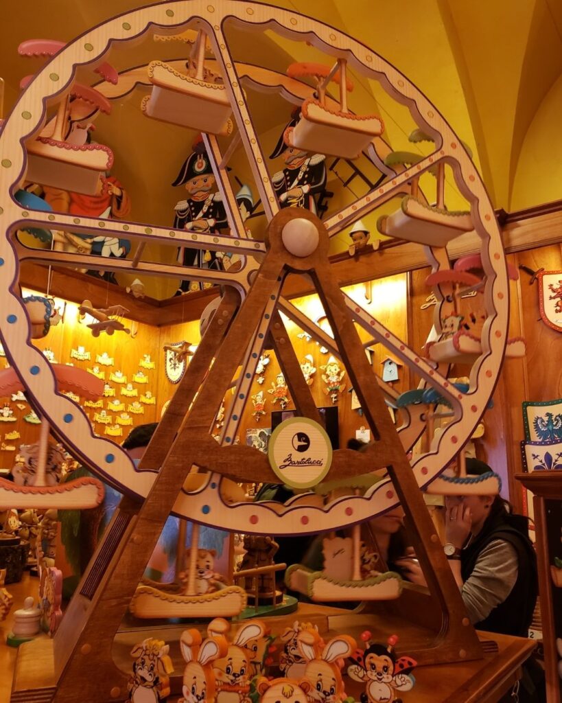 A wooden ferris wheel toy inside the Bartolucci wood shop in Rome.
