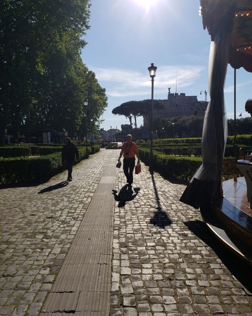 Close-up of uneven cobblestone path in Rome.