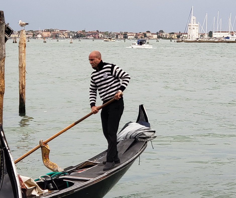 The gondolier in his striped shirt.