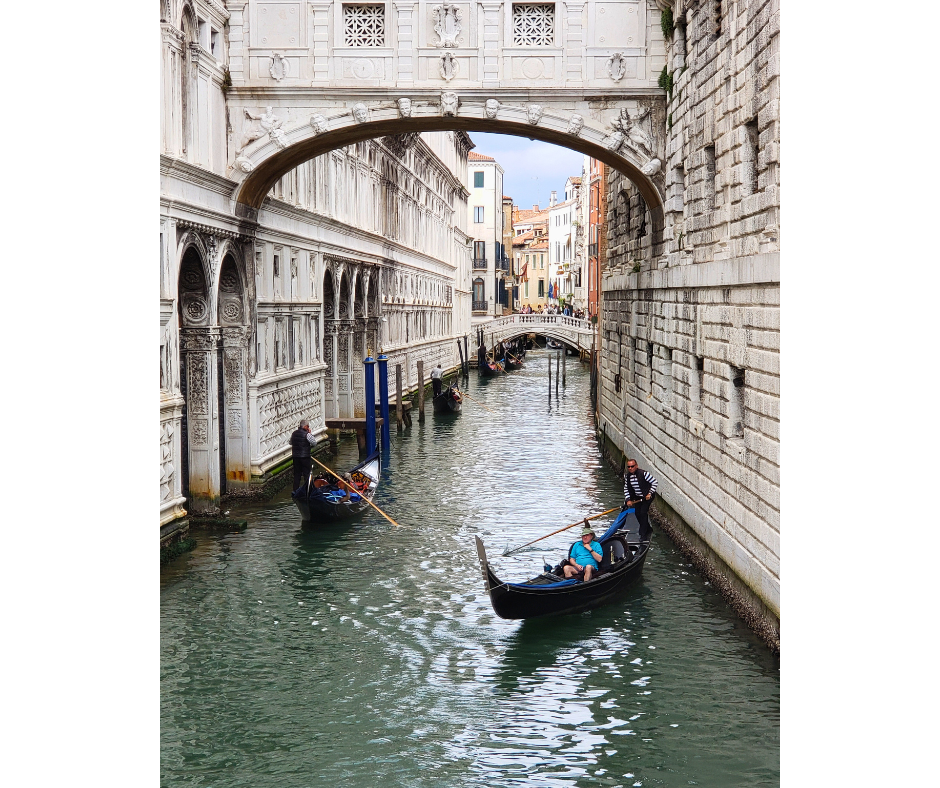 The Bridge of Sighs with gondolas passing underneath