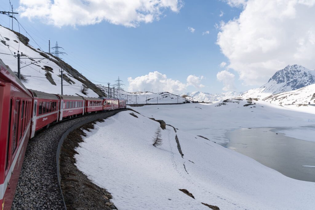 Bernina Express train looping across the Brusio Spiral Viaduct in Switzerland
